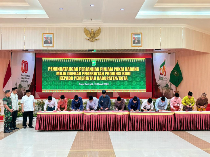 Bupati Kampar Hadiri Penandatanganan Perjanjian Pinjam Pakai BMD Pemprov Riau untuk Gerai Koperasi Merah Putih